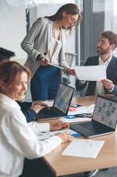 Beautiful,Business,People,Are,Using,Gadgets,,Talking,And,Smiling,During Beautiful business people are using gadgets, talking and smiling during the conference in office